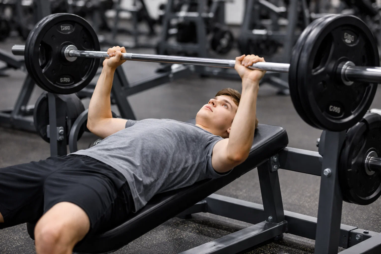 A beginner bench pressing in the gym